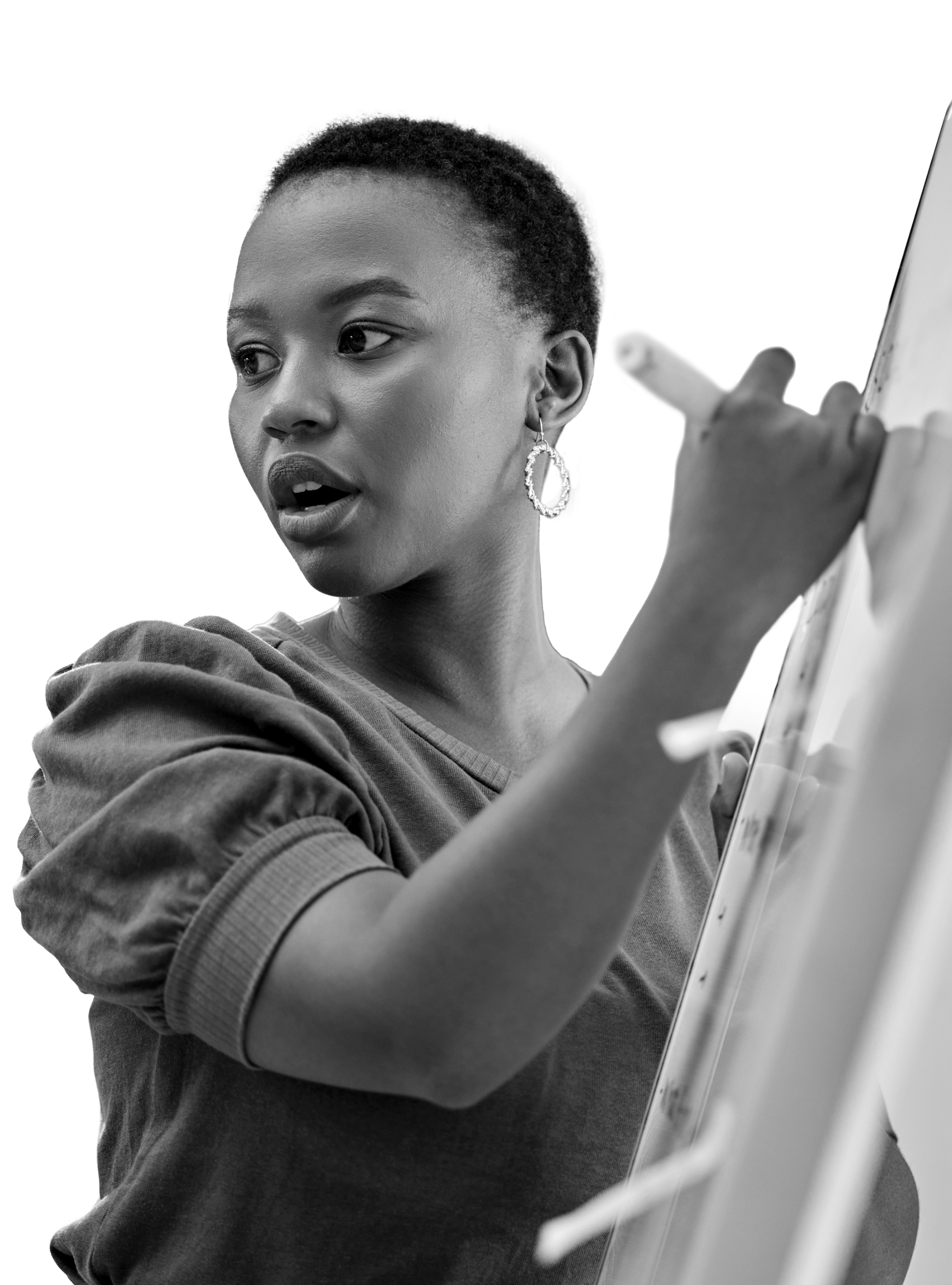 woman writing on white board